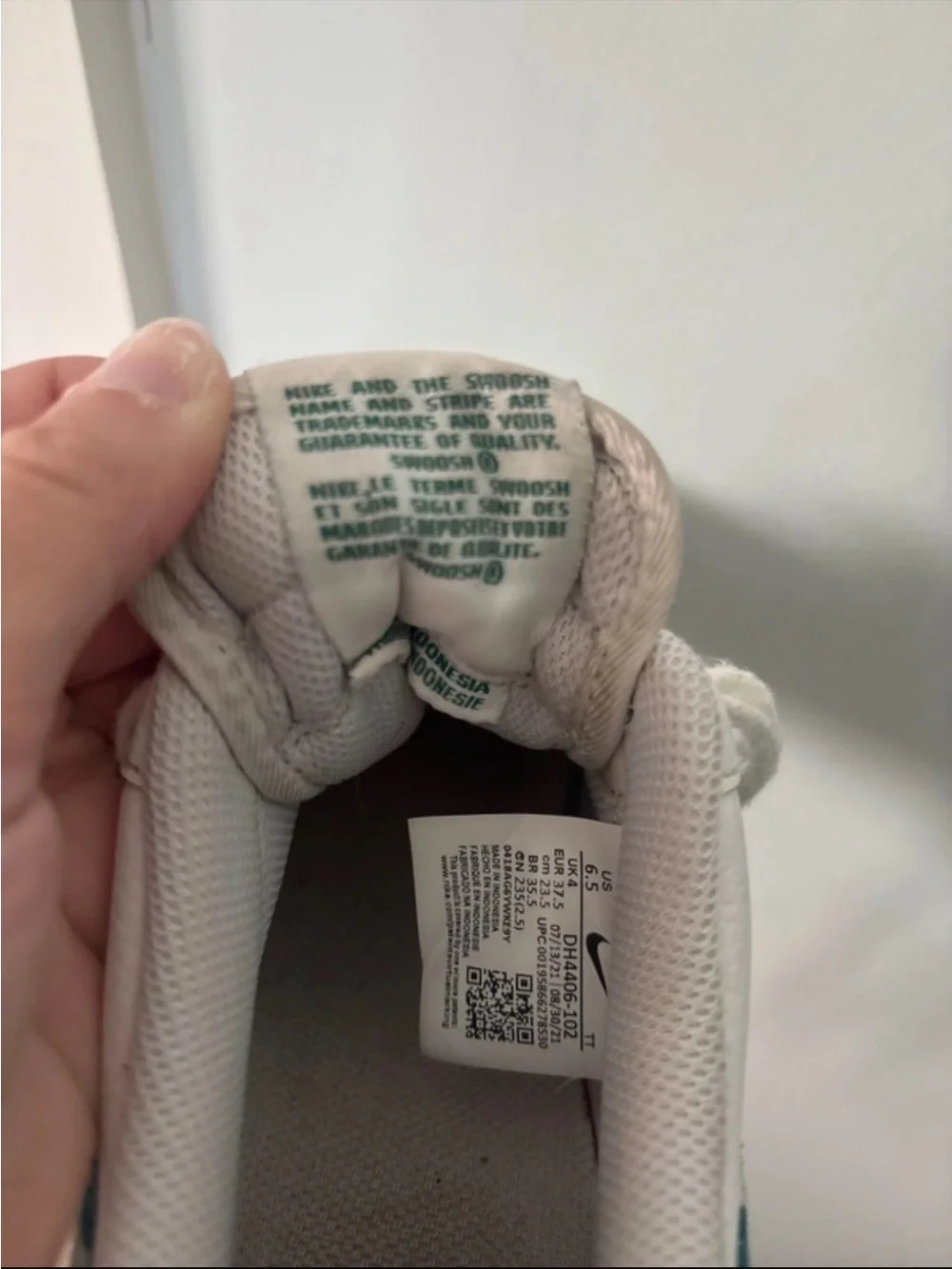 Nike Womens White Sneakers with Green Swoosh Accent
